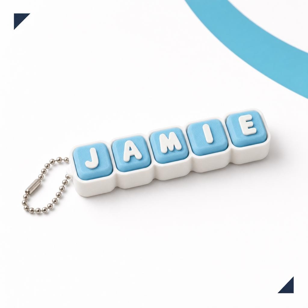 Light blue personalised keycap clicker keychain showing the slim body and ball chain.