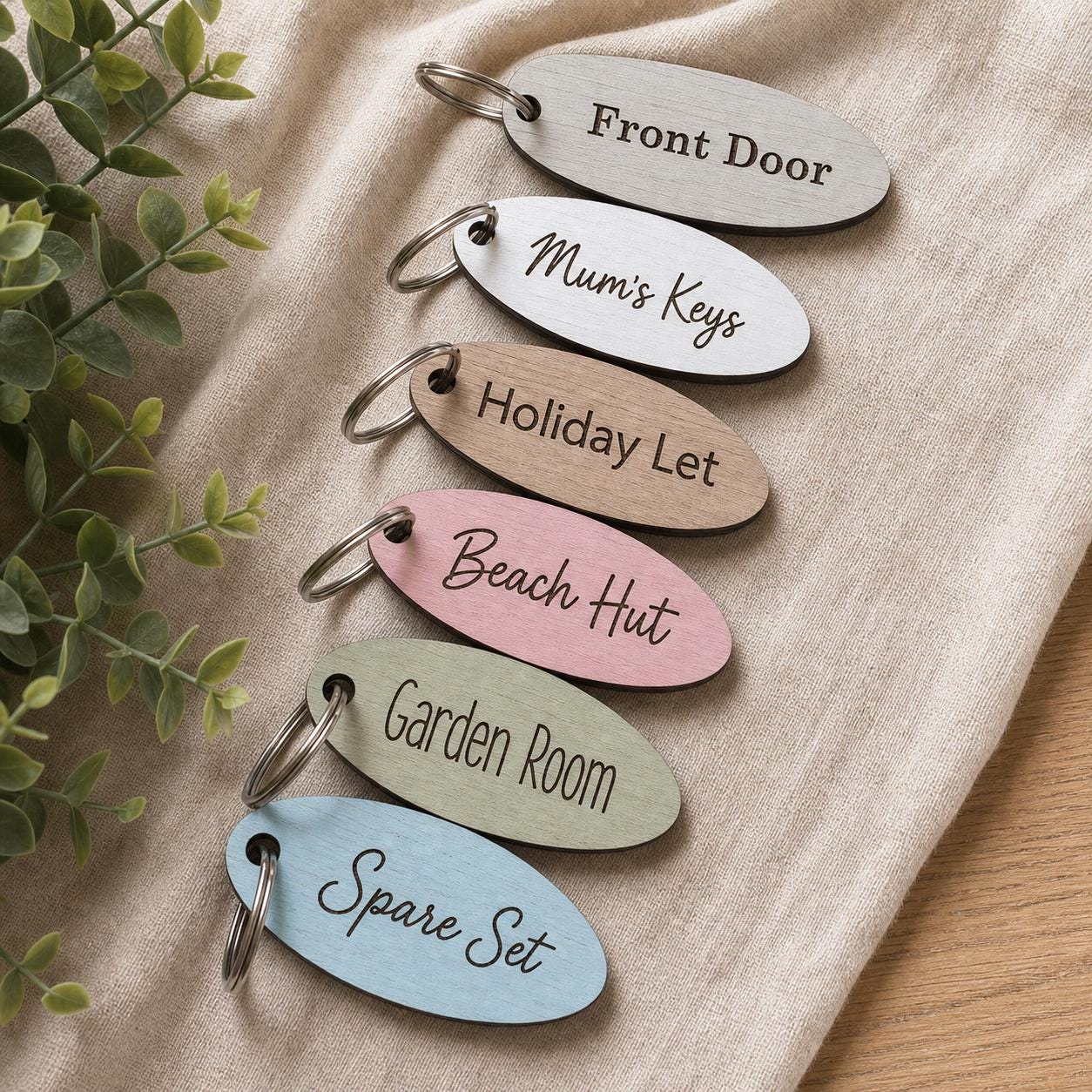 Personalised Oval Wooden Beach Hut Keyring, Coastal Cabin Keys, Laser Engraved Fob