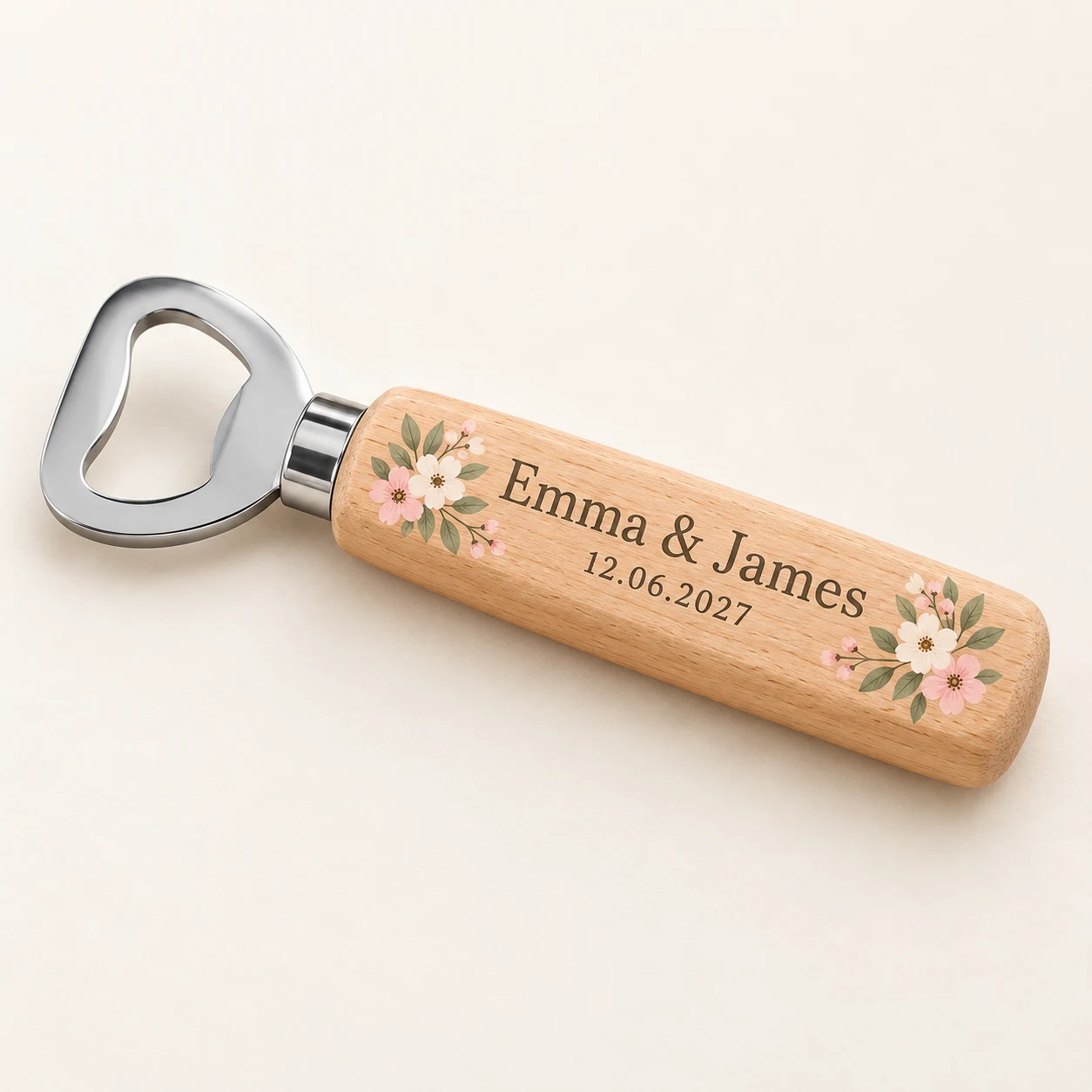 Product mockup of a wooden opener with full-colour floral print and Emma and James wedding wording
